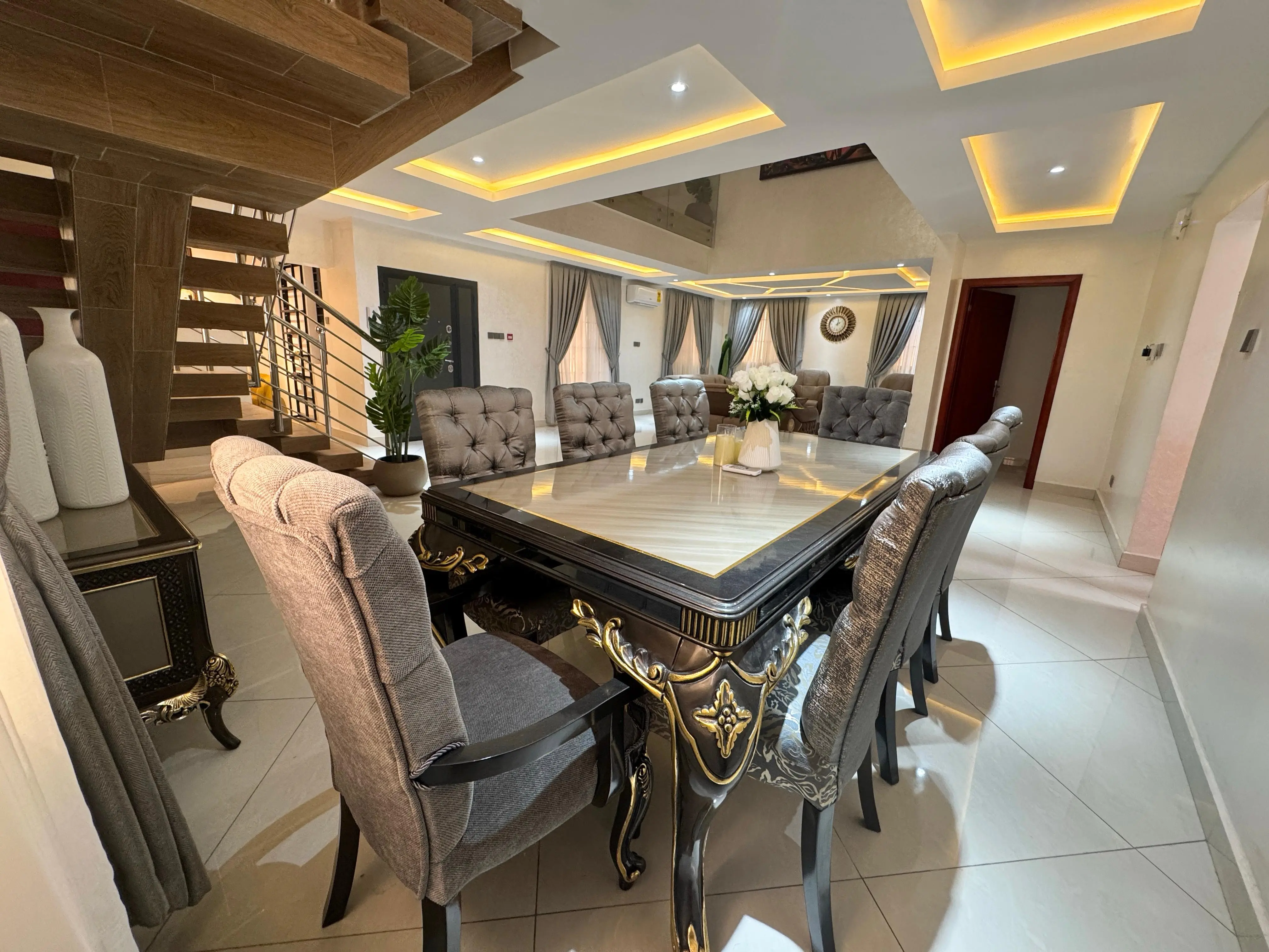 Contemporary family lounge with geometric ceiling lights